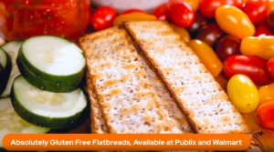 Crispy gluten-free flatbreads with cucumbers and cherry tomatoes, promoted as available at Publix and Walmart.