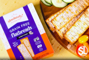 A long, rectangular, golden-brown flatbread cracker with a crisp texture, small holes, and slightly uneven surface.