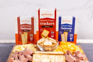 Absolutely! Gluten Free snacks displayed with cheese, crackers, and sausage on a charcuterie board.